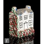 A 19th Century Pratt type pearlware money box formed as a cottage with painted windows and door, the