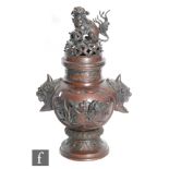 A Chinese late Qing Dynasty (1644-1912) bronze lidded vase/Incense vase, the spreading circular