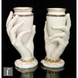 A mirrored pair of 19th Century Royal Worcester spill vases modelled as Mrs Hadley's hands holding a