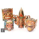 A collection of Himlayan/Tibetan wooden Buddhist Makhala demon dance masks, to include four