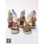 Five 20th Century painted composite garden gnomes each playing a musical instrument, double bass,