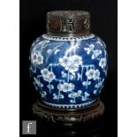 A 19th Century Chinese blue and white Prunus jar, of rounded ovoid form decorated with blossoming