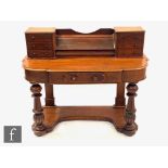 A Victorian mahogany duchess dressing table on fluted legs united by an undertier, lacking shelf