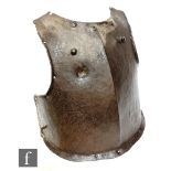 An English civil war period siege iron breast plate, with musket ball test, height 44cm.