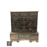 An 18th century Chinoiserie lacquered chest of three short drawers over three long drawers above a