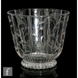 A Stuart cut glass vase of footed and tapered cylinder form, decorated with panels of intaglio cut