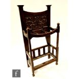 A Liberty style carved oak umbrella stand, height 110cm x depth 26cm x width 53cm,