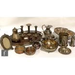 A parcel lot of assorted silver plated items to include a wooden base tray, bottle coasters,