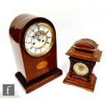 An Edwardian mahogany line inlaid bracket or mantel clock of stepped dome form, the white