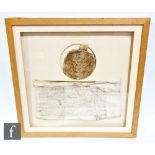 An Elizabeth I wax great seal with indenture, the queen depicted seated on her throne below a