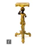 A 20th Century gilt 'blackamoor' figure of a boy wearing a turban below an apron stand, holding a