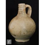 A Rhenish salt glazed stoneware bellarmine jug or bartmannkrug stoneware jug, tape glazed with a
