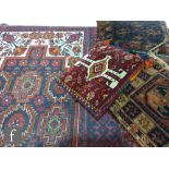 A Hamadan style rug, floral stylized corner panels with a geometric border, 183cm x 100cm, and three