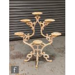 A Victorian style white painted cast iron six tier plant pot stand, height 98cm.