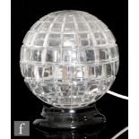A later 20th Century Riedel spherical table lamp, the clear crystal in two halves and mitre cut with