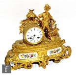 A late 19th to early 20th century French gilt metal mantel clock by Henri Marc Paris, mounted with a