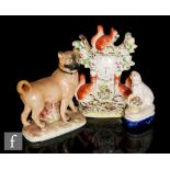 A 19th Century Staffordshire model of a pug dog stood on a naturalistic base, height 22.5cm,