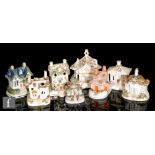 Eight 19th century Staffordshire pastel burners of varying forms, mostly with pierced windows and