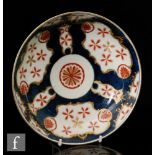 A late 18th Century Worcester saucer dish decorated in the Old Japan Star pattern against a blue