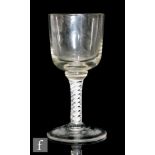 An 18th Century and later drinking glass, the later ovoid bowl applied to an 18th Century double