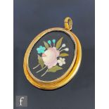 An early 20th Century 9ct pietra dura oval pendant depiction of a floral spray, length 4cm, weight