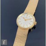 A lady's 9ct hallmarked Eterna-matic Sahida wrist watch, batons to a silvered circular dial,