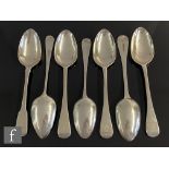 Seven assorted 19th century hallmarked silver table spoons, each with engraved initial to the