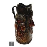 A 19th Century leather three sided face blackjack style jug or tyg, with angular noses and