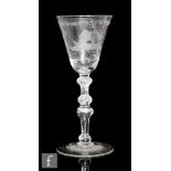 An 19th Century drinking glass in the 18th Century Newcastle Baluster style with a round funnel bowl