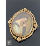 A late 19th Century 9ct framed oval transfer printed miniature, three quarter length profile of a