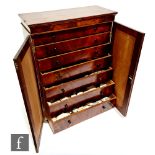 A George IV mahogany collectors cabinet fitted with seven graduated drawers, turned handles, on a