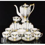 A 1930s Shelley Art Deco Queen Anne Tall Trees pattern coffee set comprising coffee pot, six cups