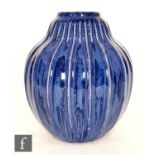 An early 20th Century Royal Doulton vase of gourd form, the whole decorated in a streaked blue