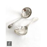 Two hallmarked silver caddy spoons one with shell bowl and plain handle, the other with bright cut