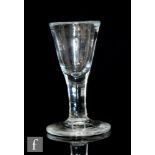 An 18th Century drinking glass circa 1760, with slightly deceptive round funnel bowl above a plain