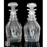 A near pair of late Georgian decanters of Prussian form, each with slice cut decoration at the