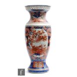 A Japanese Imari vase, Meiji period (1868-1912), of baluster form, rising to a reticulated dish rim,