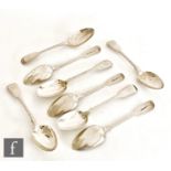 A composed set of eight hallmarked silver fiddle pattern dessert spoons each with engraved crest