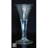 A large 18th Century goblet circa 1750, the drawn trumpet bowl above a plain stem and raised to a