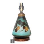 An early 20th century Galle cameo glass lamp base of conical form, cased in cinnamon and cut with