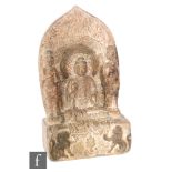 A carved stone Buddhist votive stele, probably Tang Dynasty (618-907), carved in relief depicting
