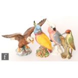 Three Beswick birds comprising a 1018 Bald Eagle with outstretched wings and two 1180 Cockatoo (