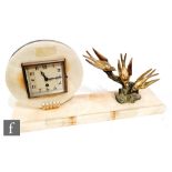 An Art Deco alabaster mantle clock, the circular movement set with a square dial and eight day