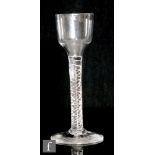 An 18th Century drinking glass circa 1750, the ogee bowl above a double series air twist stem,