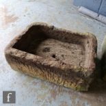 A rectangular sandstone trough, height 26cm, width 60cm and depth 44cm, S/D.