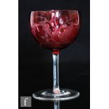 A late 19th Century Thomas Webb & Sons wine glass, the cup bowl cased in ruby over clear and cut