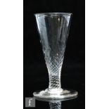 An 18th Century dwarf ale glass circa 1780, the drawn funnel bowl with basal wrythen moulding