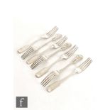 A set of seven hallmarked silver fiddle pattern dessert fork with engraved crest to reverse of