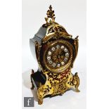 An early 20th Century French boulle work mantle clock in cartouche case, white circular enamelled