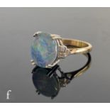 A 9ct hallmarked triplet opal and diamond ring, central oval claw set opal, length 12mm, with
